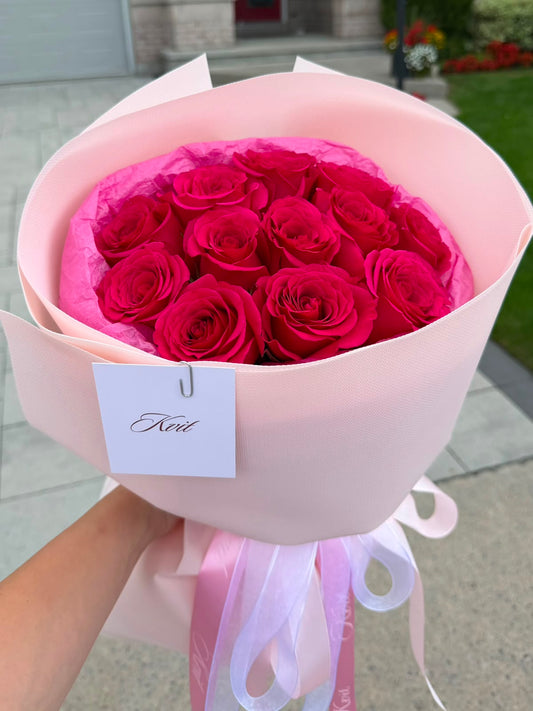 12 Hot pink roses